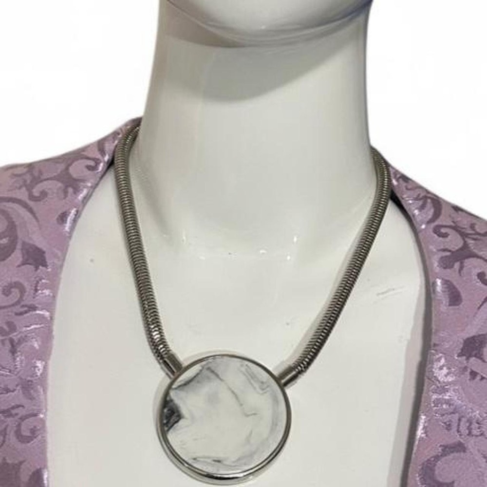 Silver-tone necklace with a large round pendant